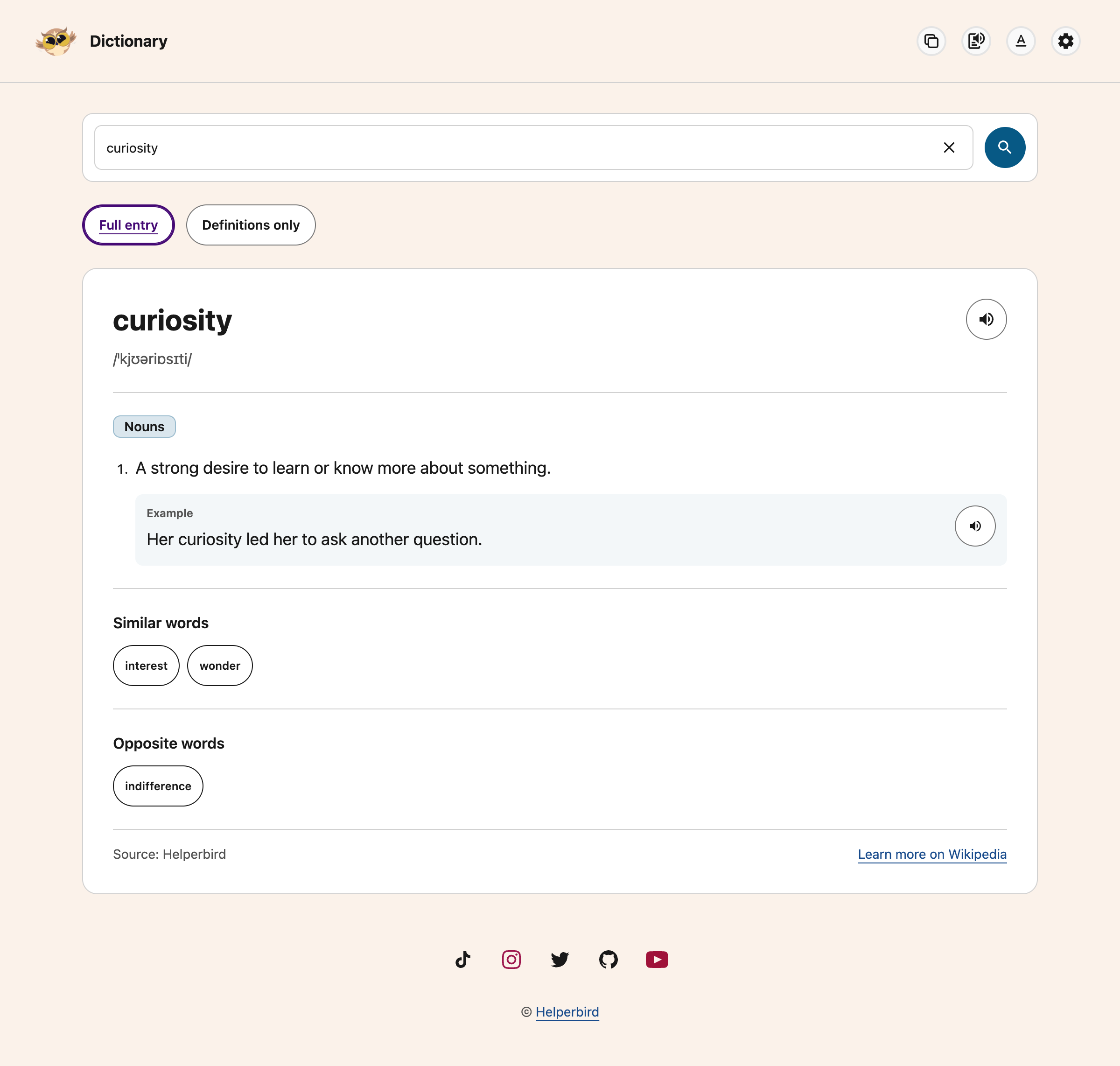 Dictionary entry for curiosity with pronunciation, a definition, an example and related words
